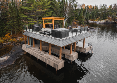 Alternate aerial view of boathouse with roof top gathering area.