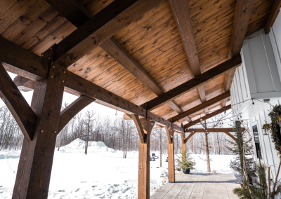 Covered entry timber home.