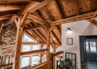 Braces, posts, and ceiling in timber framed house.