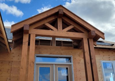 Timber entry detail under construction.