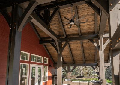 Large covered deck with large timbers.