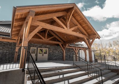 Full front view of timber church entryway.