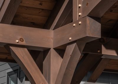 Detail of knee brace on timber framed entryway.